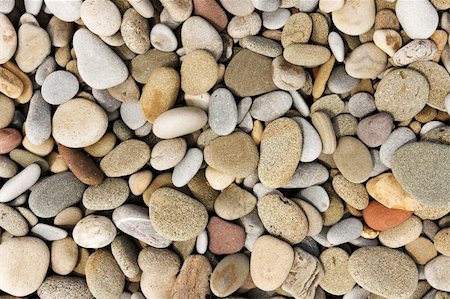 simsearch:400-05270612,k - Smooth pebble background from a beach shore. Photographie de stock - Aubaine LD & Abonnement, Code: 400-04604424