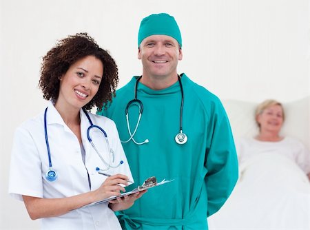 Doctors attending a patient in the hospital Stock Photo - Budget Royalty-Free & Subscription, Code: 400-04604479