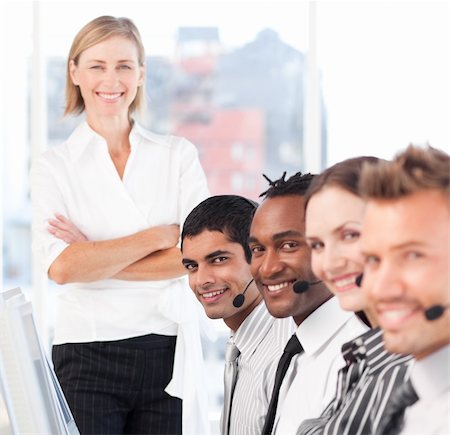 Business team smiling and being happy at work Stock Photo - Budget Royalty-Free & Subscription, Code: 400-04604987