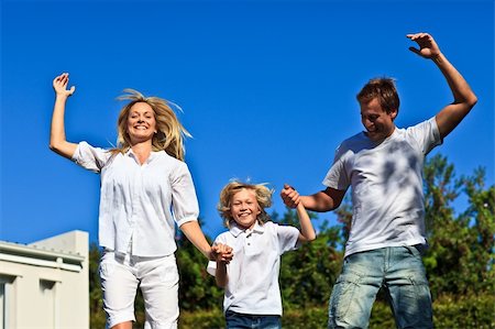 Happy Family Jumping in the air Stock Photo - Budget Royalty-Free & Subscription, Code: 400-04604997