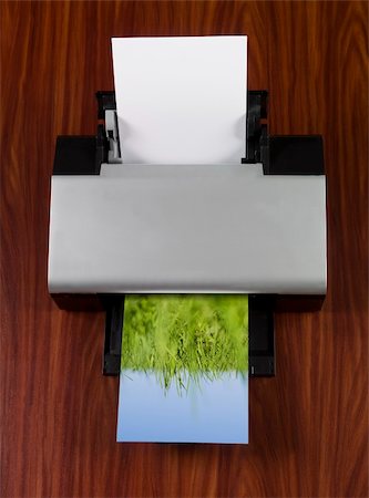 printer paper - Printer prints an image with green grass towards blue sky Foto de stock - Super Valor sin royalties y Suscripción, Código: 400-04605048