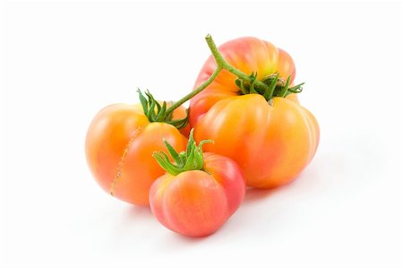 Three Hillbilly, an heirloom variety, Tomatoes isolated on white (6175) Foto de stock - Super Valor sin royalties y Suscripción, Código: 400-04605049