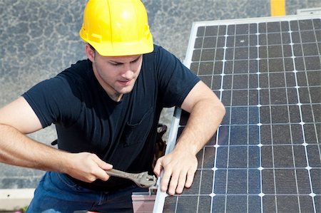 Green job series - young electrician repairs solar panel. Stock Photo - Budget Royalty-Free & Subscription, Code: 400-04605055