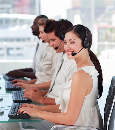 simsearch:400-04119293,k - Young Attractive businesswoman smiling on headset Fotografie stock - Microstock e Abbonamento, Codice: 400-04605326