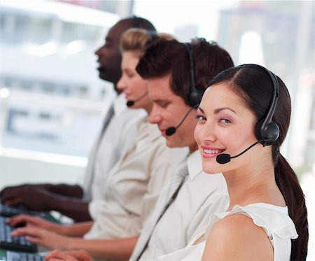 simsearch:400-04119293,k - Young Attractive businesswoman smiling on headset Fotografie stock - Microstock e Abbonamento, Codice: 400-04605328