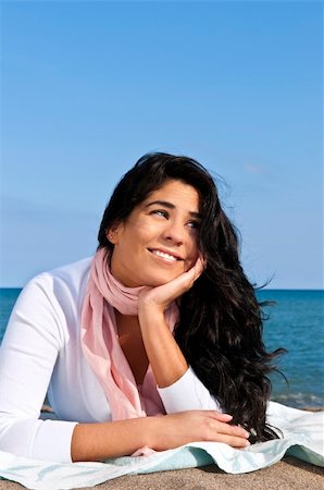 elenathewise (artist) - Portrait of beautiful smiling native american girl laying at beach Photographie de stock - Aubaine LD & Abonnement, Code: 400-04605497