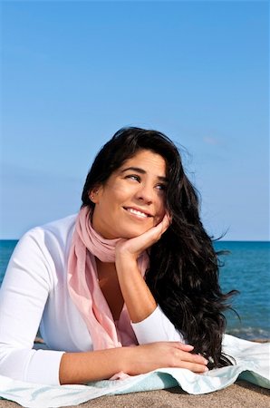 simsearch:614-06442655,k - Portrait of beautiful smiling native american girl laying at beach Photographie de stock - Aubaine LD & Abonnement, Code: 400-04605497