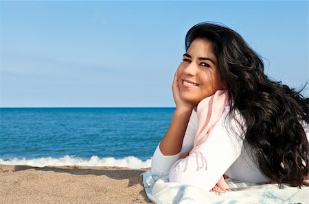 simsearch:614-06442655,k - Portrait of beautiful smiling native american girl laying at beach Photographie de stock - Aubaine LD & Abonnement, Code: 400-04605498