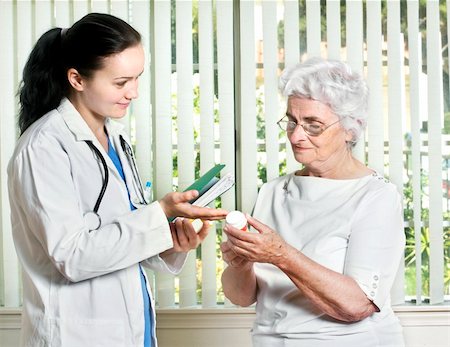 Young female doctor with senior patient Stock Photo - Budget Royalty-Free & Subscription, Code: 400-04606738