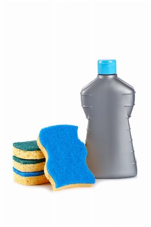 simsearch:600-02231872,k - Detergent bottle and sponges reflected on white background. Shallow depth of field Stock Photo - Budget Royalty-Free & Subscription, Code: 400-04607056