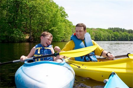 father son camping woods - Father and son kayaking Stock Photo - Budget Royalty-Free & Subscription, Code: 400-04607333