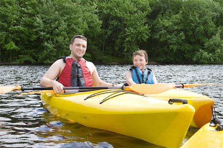 simsearch:400-04607337,k - Father and son kayaking Stockbilder - Microstock & Abonnement, Bildnummer: 400-04607350