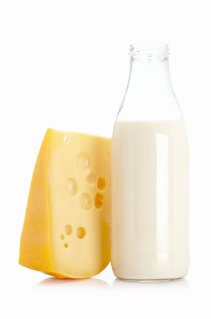Slice of fresh cheese and milk bottle isolated on white background Foto de stock - Super Valor sin royalties y Suscripción, Código: 400-04607539