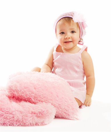 pillow feather - Baby girl sitting with pink fluffy pillows Stock Photo - Budget Royalty-Free & Subscription, Code: 400-04607684