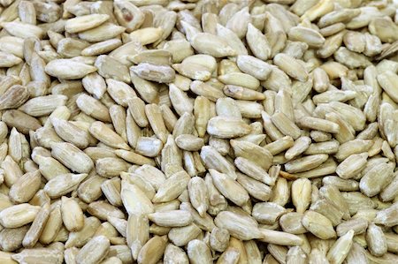 semilla (para pájaro) - Sunflower seeds make natural texture. Shot in studio. Foto de stock - Super Valor sin royalties y Suscripción, Código: 400-04607793