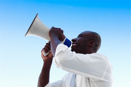 simsearch:400-04126489,k - Smiling young Business man shouting into a megaphone Stock Photo - Budget Royalty-Free & Subscription, Code: 400-04608327