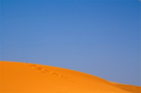 simsearch:400-05192544,k - walking on Sahara, Erg Chebbi, Morocco Stock Photo - Budget Royalty-Free & Subscription, Code: 400-04608874