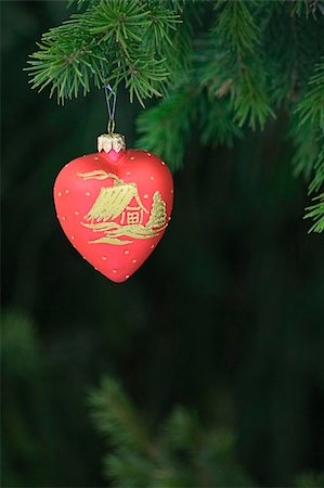 simsearch:400-06477568,k - Heart shape christmas-tree decoration on green coniferous tree Stock Photo - Budget Royalty-Free & Subscription, Code: 400-04608898