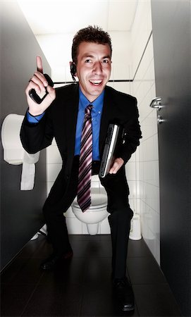 simsearch:400-04608943,k - happy businessman with one finger up standing in restroom Stock Photo - Budget Royalty-Free & Subscription, Code: 400-04608943