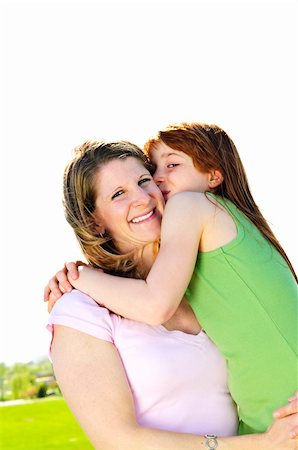 simsearch:400-04612785,k - Portrait of happy child hugging and kissing her mother Stock Photo - Budget Royalty-Free & Subscription, Code: 400-04609129