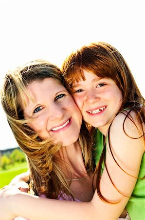 simsearch:400-04612785,k - Portrait of happy child hugging her mother Stock Photo - Budget Royalty-Free & Subscription, Code: 400-04609130