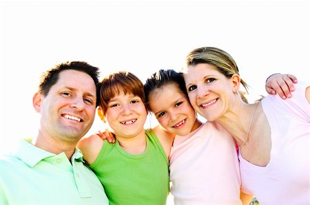 simsearch:400-04115211,k - Portrait of happy family of four hugging and smiling Foto de stock - Super Valor sin royalties y Suscripción, Código: 400-04609131