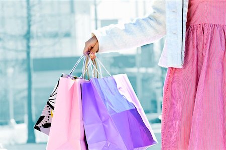 shopping spree mall - Young girl holding shopping bags at mall Stock Photo - Budget Royalty-Free & Subscription, Code: 400-04609141