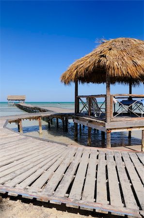 simsearch:400-08223992,k - A view of wooden footbridge on tropical beach resort, cayo coco, cuba Stock Photo - Budget Royalty-Free & Subscription, Code: 400-04609196