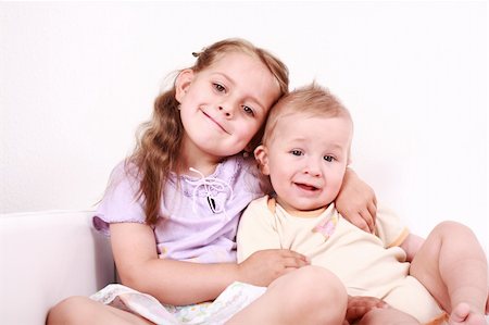 simsearch:400-07088886,k - Cute little girl with her small brother together Stock Photo - Budget Royalty-Free & Subscription, Code: 400-04609302