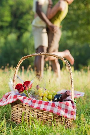 portrait of young multiethnic couple picnicking in park Stock Photo - Budget Royalty-Free & Subscription, Code: 400-04609413