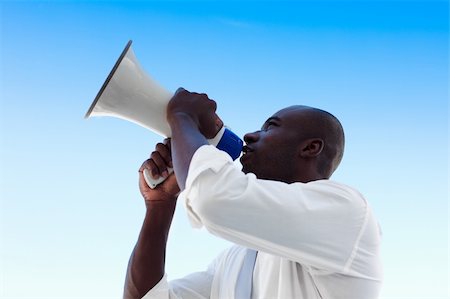 simsearch:400-04126489,k - African businessman shouting in a megaphone Stock Photo - Budget Royalty-Free & Subscription, Code: 400-04609994