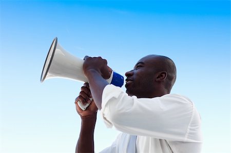 simsearch:400-04126489,k - African businessman shouting in a megaphone Stock Photo - Budget Royalty-Free & Subscription, Code: 400-04609995