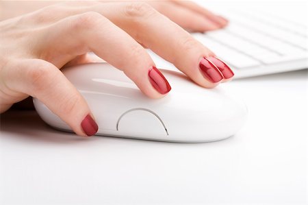 Fingers with red nail holding a mouse Stock Photo - Budget Royalty-Free & Subscription, Code: 400-04600251