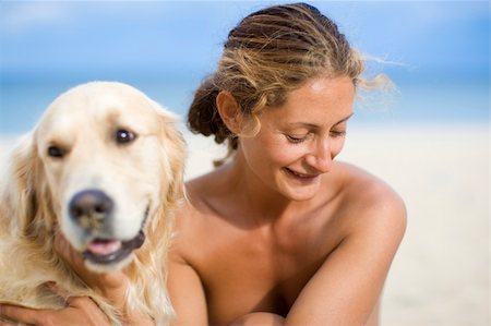 emotional golden retriever - Young girl embracing her dog Stock Photo - Budget Royalty-Free & Subscription, Code: 400-04600446