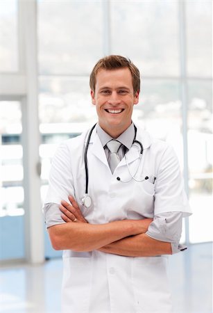 doctors office insurance patient - Potrait of a confident MaleDoctor with Folded arms looking at camera Stock Photo - Budget Royalty-Free & Subscription, Code: 400-04600747