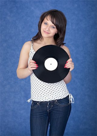 Lady with vinyl record on the blue background Stock Photo - Budget Royalty-Free & Subscription, Code: 400-04601625