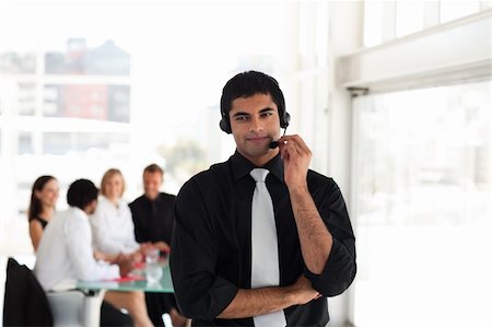 simsearch:400-04129170,k - Young Businessman on a headset Fotografie stock - Microstock e Abbonamento, Codice: 400-04602787