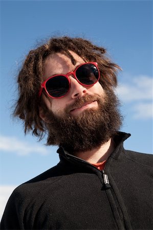 pilot pose - A funny portrait of a male with a full beard and sunglasses Stock Photo - Budget Royalty-Free & Subscription, Code: 400-04602889