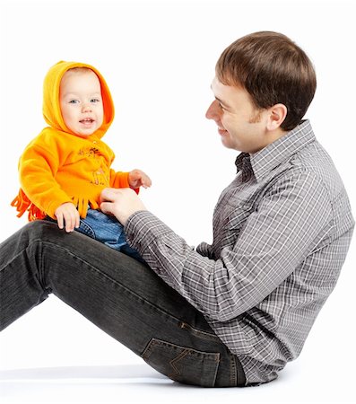 simsearch:400-07715953,k - Laughing baby sitting on daddy's knees Stock Photo - Budget Royalty-Free & Subscription, Code: 400-04602963