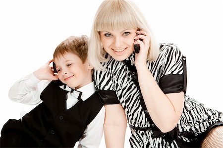 Mother and son talking over cellphones, isolated Stock Photo - Budget Royalty-Free & Subscription, Code: 400-04602979