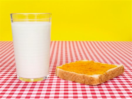 simsearch:400-05387533,k - A glass of milk and a toast spread with jam over the table. Stock Photo - Budget Royalty-Free & Subscription, Code: 400-04603072