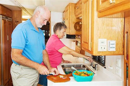 senior couple rv - Senior couple cooking in the kitchen of their motor home. Stock Photo - Budget Royalty-Free & Subscription, Code: 400-04603492