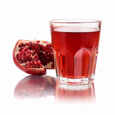 fresh half of pomegranate and juice Stock Photo - Budget Royalty-Free & Subscription, Code: 400-04603546