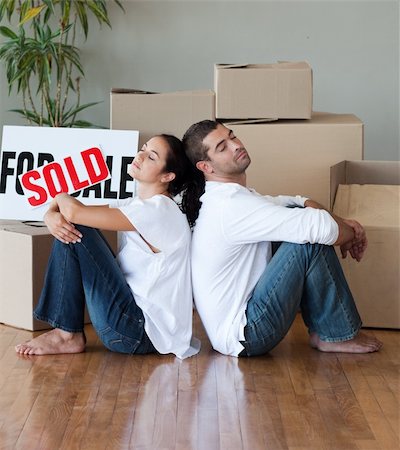 family with sold sign - Happy Young Couple Moving House Stock Photo - Budget Royalty-Free & Subscription, Code: 400-04603974