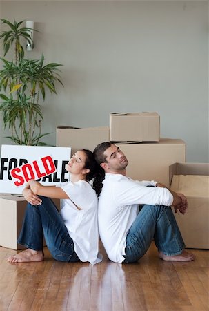 family with sold sign - Happy Young Couple Moving House Stock Photo - Budget Royalty-Free & Subscription, Code: 400-04603973