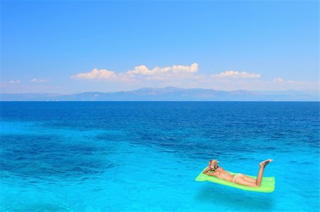 Beautiful young woman enjoying the Ionian sea in Greece Stock Photo - Budget Royalty-Free & Subscription, Code: 400-04614162