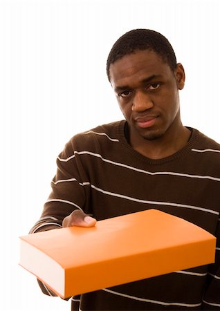 Young black man giving you a book Stock Photo - Budget Royalty-Free & Subscription, Code: 400-04614342