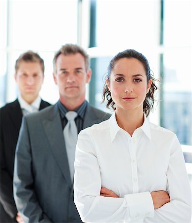 Young businesswoman with folded arms in a line Photographie de stock - Aubaine LD & Abonnement, Code: 400-04614498