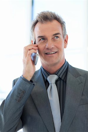 elderly male models - Senior businessman talking on phone in office Stock Photo - Budget Royalty-Free & Subscription, Code: 400-04614537