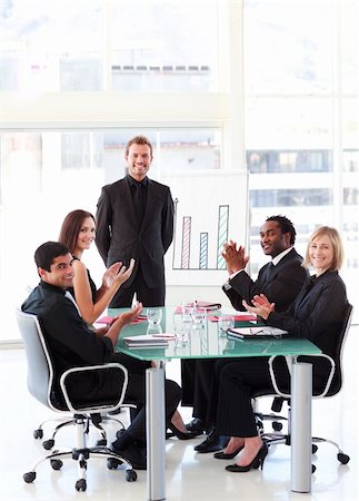 simsearch:400-04113098,k - Business people applauding a young colleague in a presentation Stock Photo - Budget Royalty-Free & Subscription, Code: 400-04614577